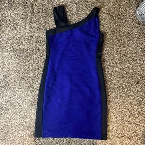 Purple cocktail dress fully lined with double shoulder strap on one side.
